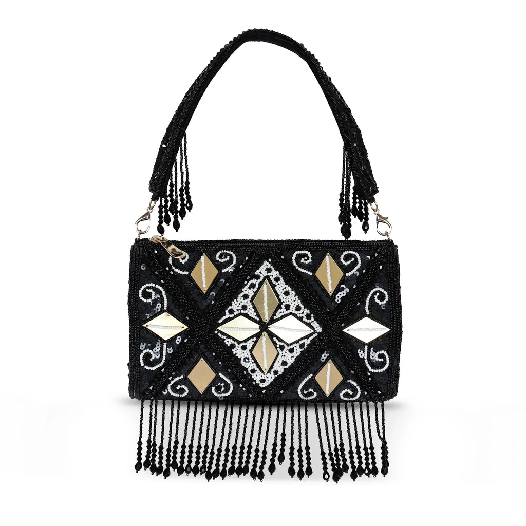 A black clutch bag with geometric embroidery pattern and tassel detailing on the front.