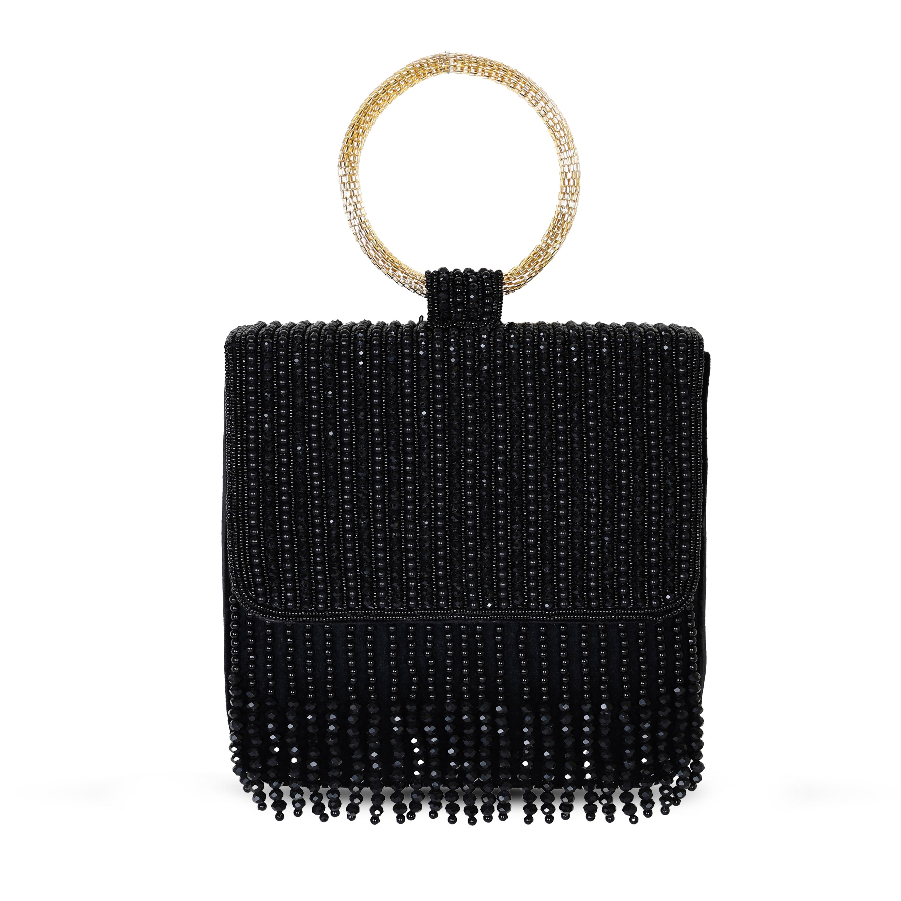 A black embroidered clutch with a golden handle and fringes, closed with a snap button.