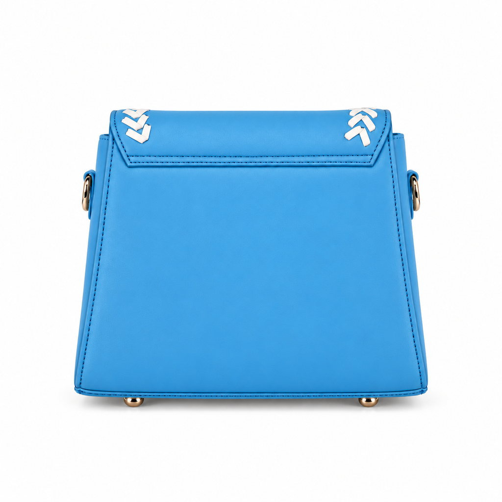 A bright blue structured leather handbag shown from the back, featuring gold-tone hardware and white chevron accents on the top flap.