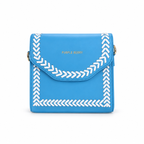 A bright blue faux-leather crossbody bag with white braided chevron trim along the flap and edges, featuring gold lettering that reads 'PURPLE BERRY' on the front, set against a plain white background.