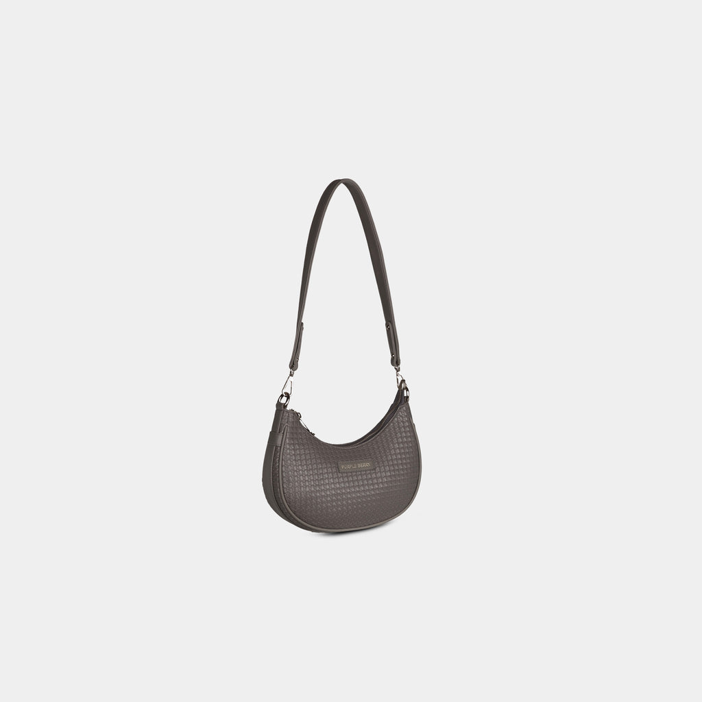 Grey Ameyaa curved baguette shoulder bag with woven pattern finish – angled perspective