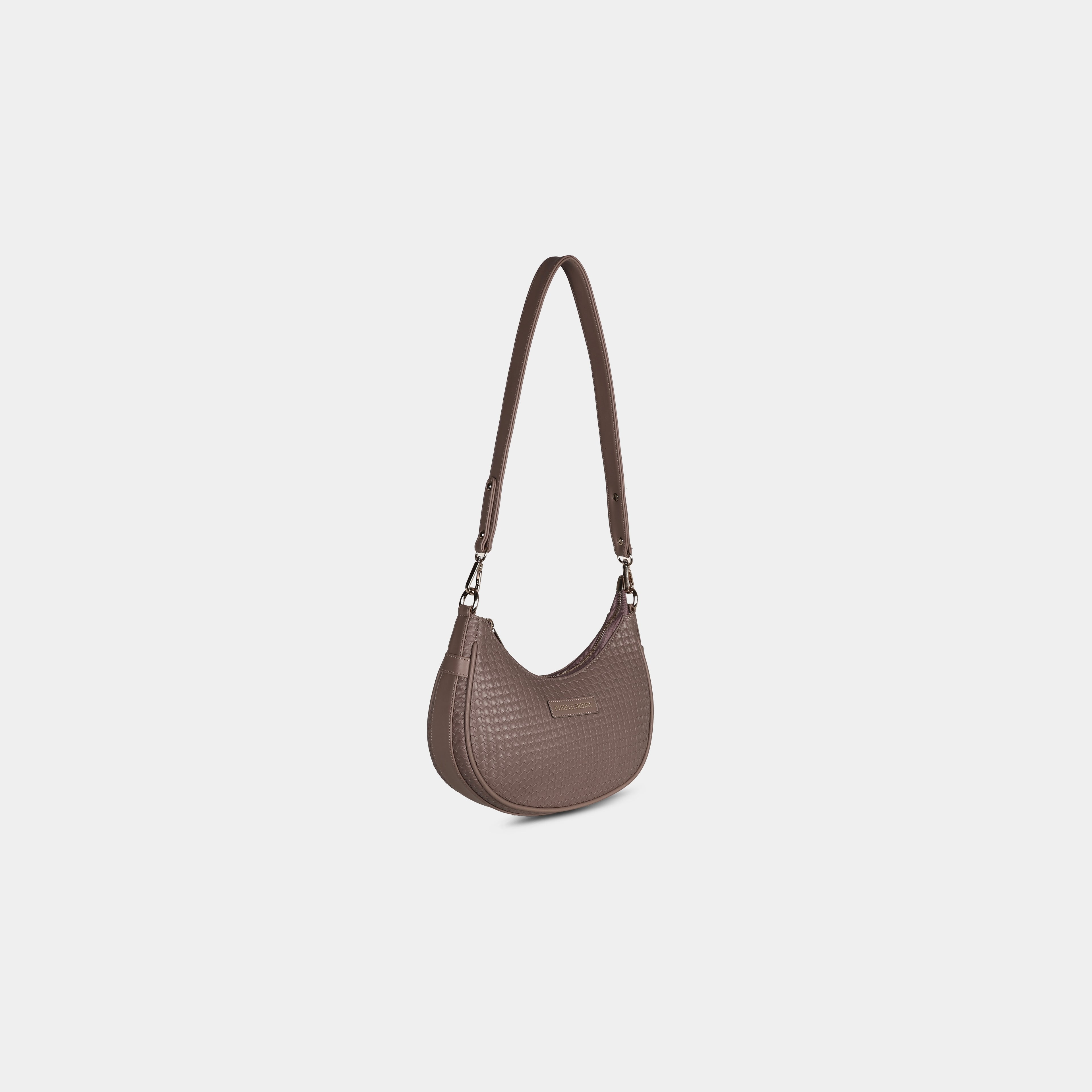 Taupe Ameyaa curved baguette shoulder bag with woven pattern finish – angled view