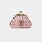Close-up of rose metallic woven texture and gold-tone kiss-lock clasp on blush pink Bijou pouch