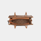 Interior compartment of brown Cleo handbag with secure zipper pocket and slip pocket