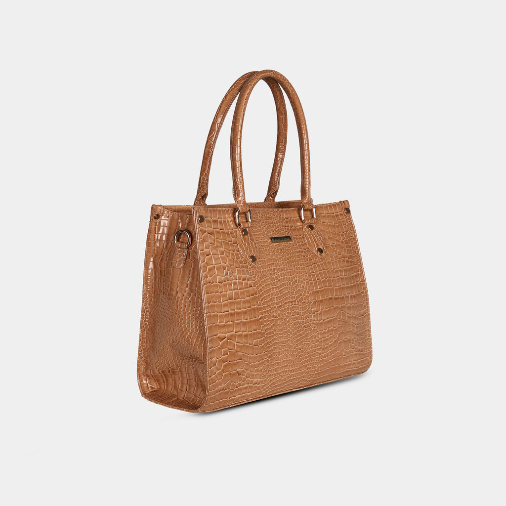 Side view of brown Cleo textured handbag showing structured design and detachable strap hooks