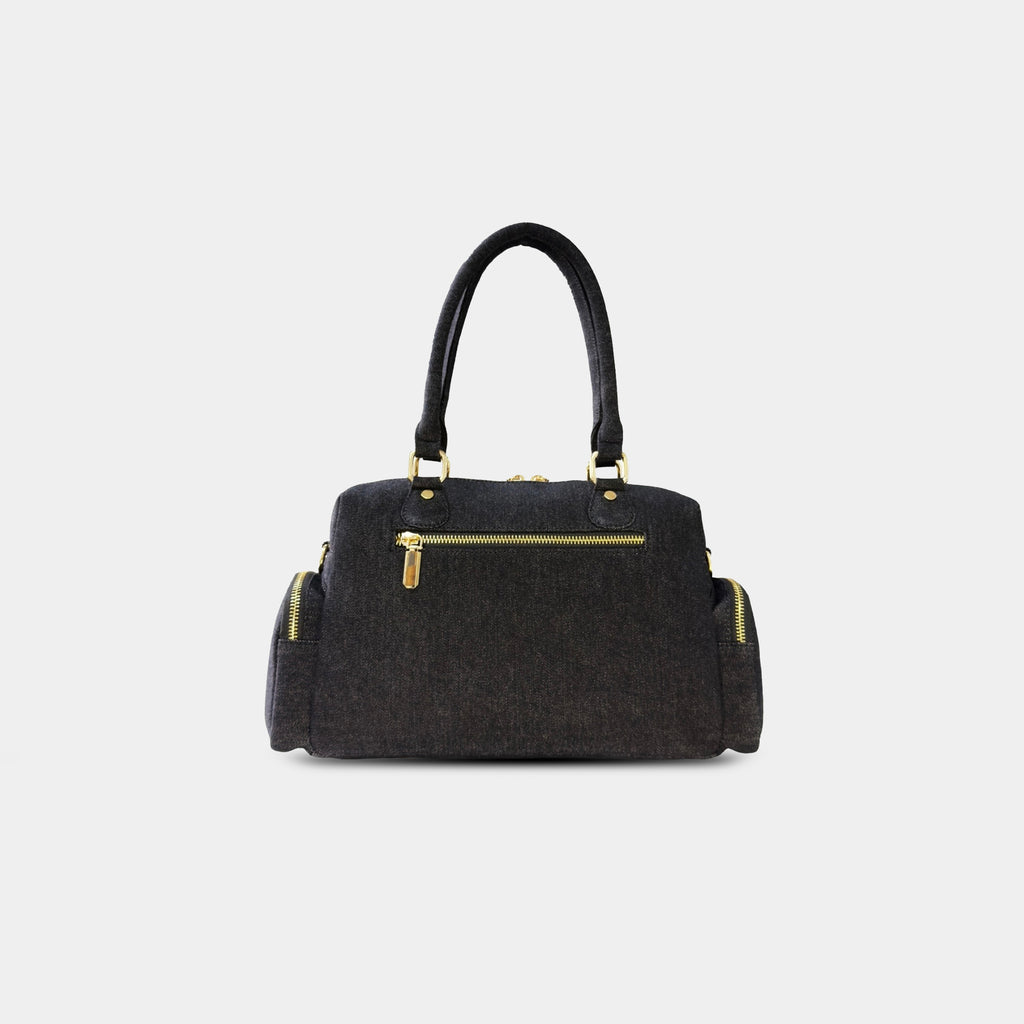 Back zipper pocket view of black Frida denim sling bag