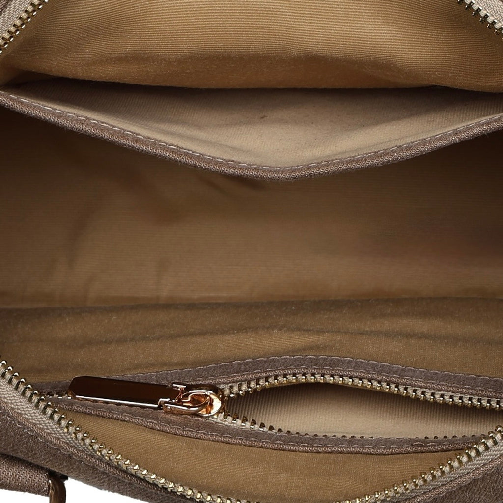 Interior compartment of brown Frida sling bag