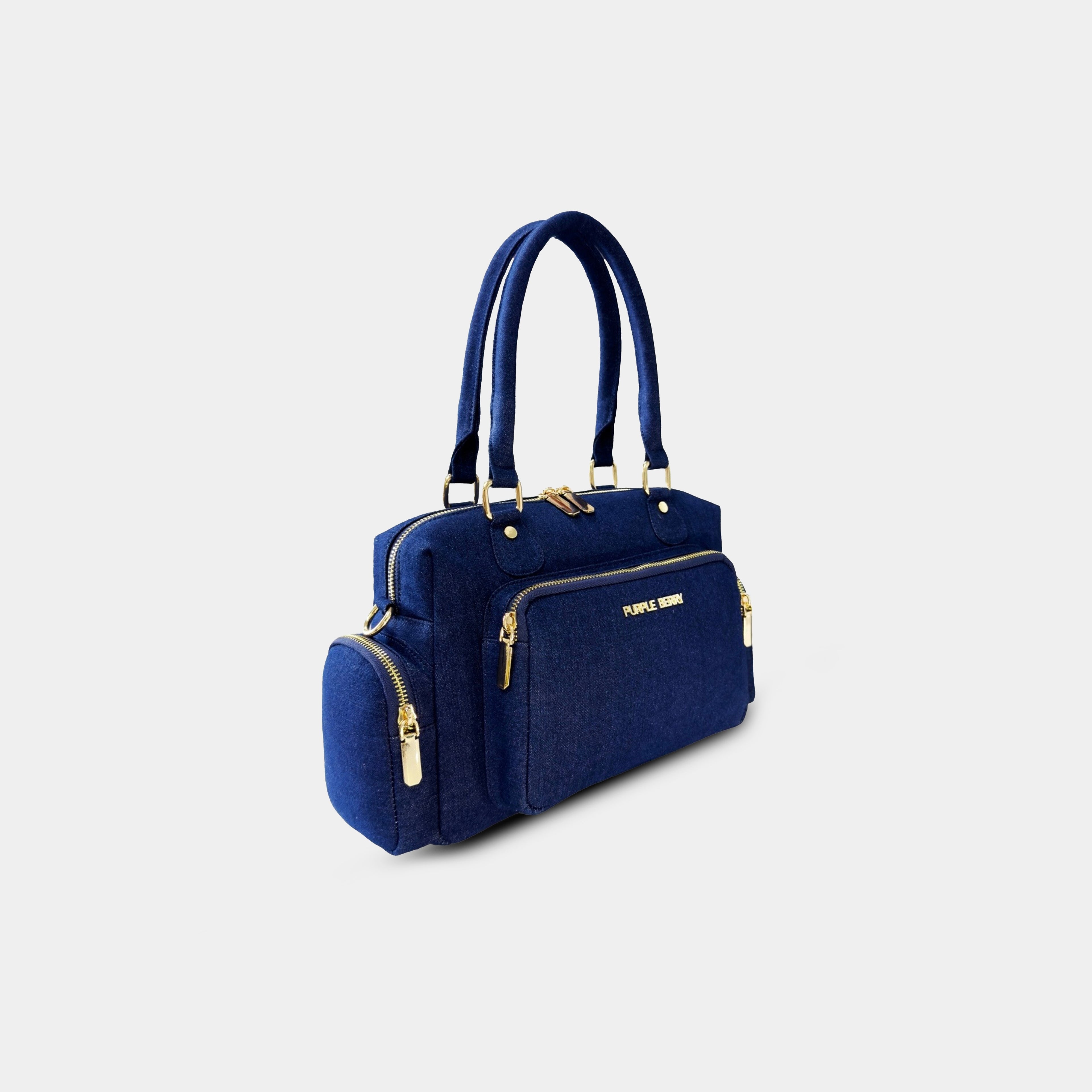 Angled perspective of dark blue Frida denim sling bag