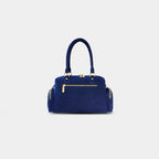 Back zipper pocket view of dark blue Frida sling bag