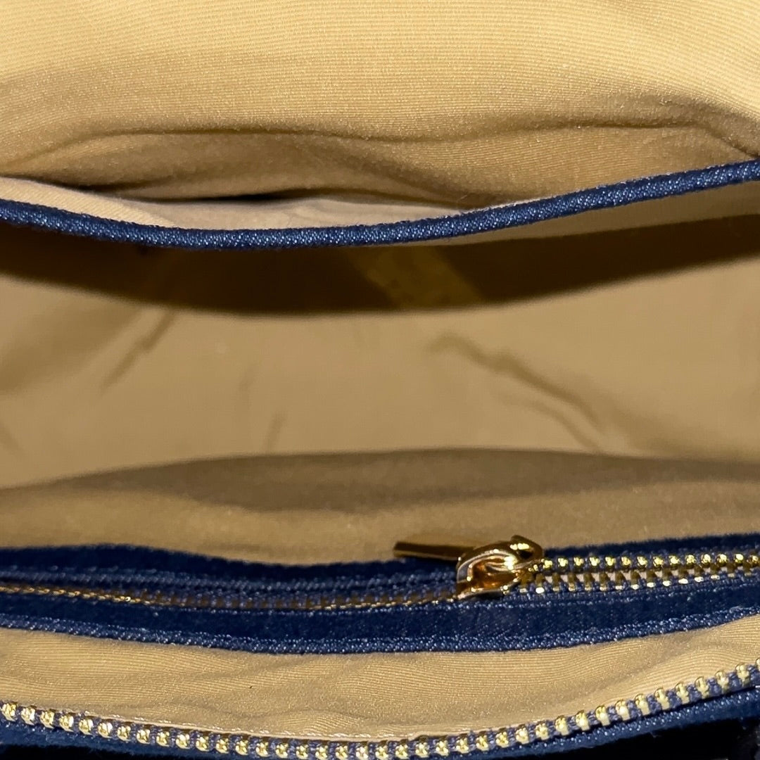 Interior compartment of dark blue Frida denim sling bag
