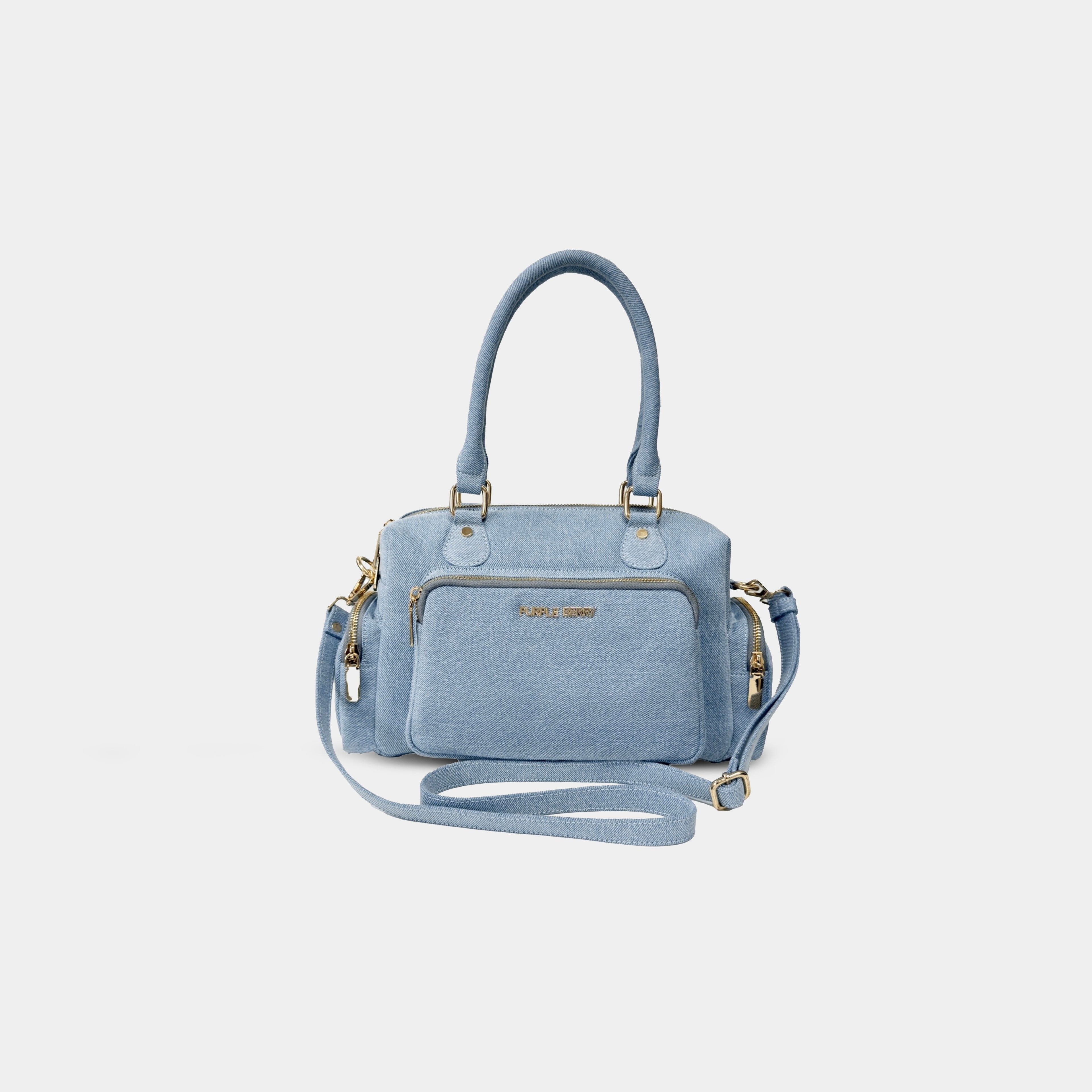 Light blue Frida denim sling bag showing front zipper pocket and gold hardware