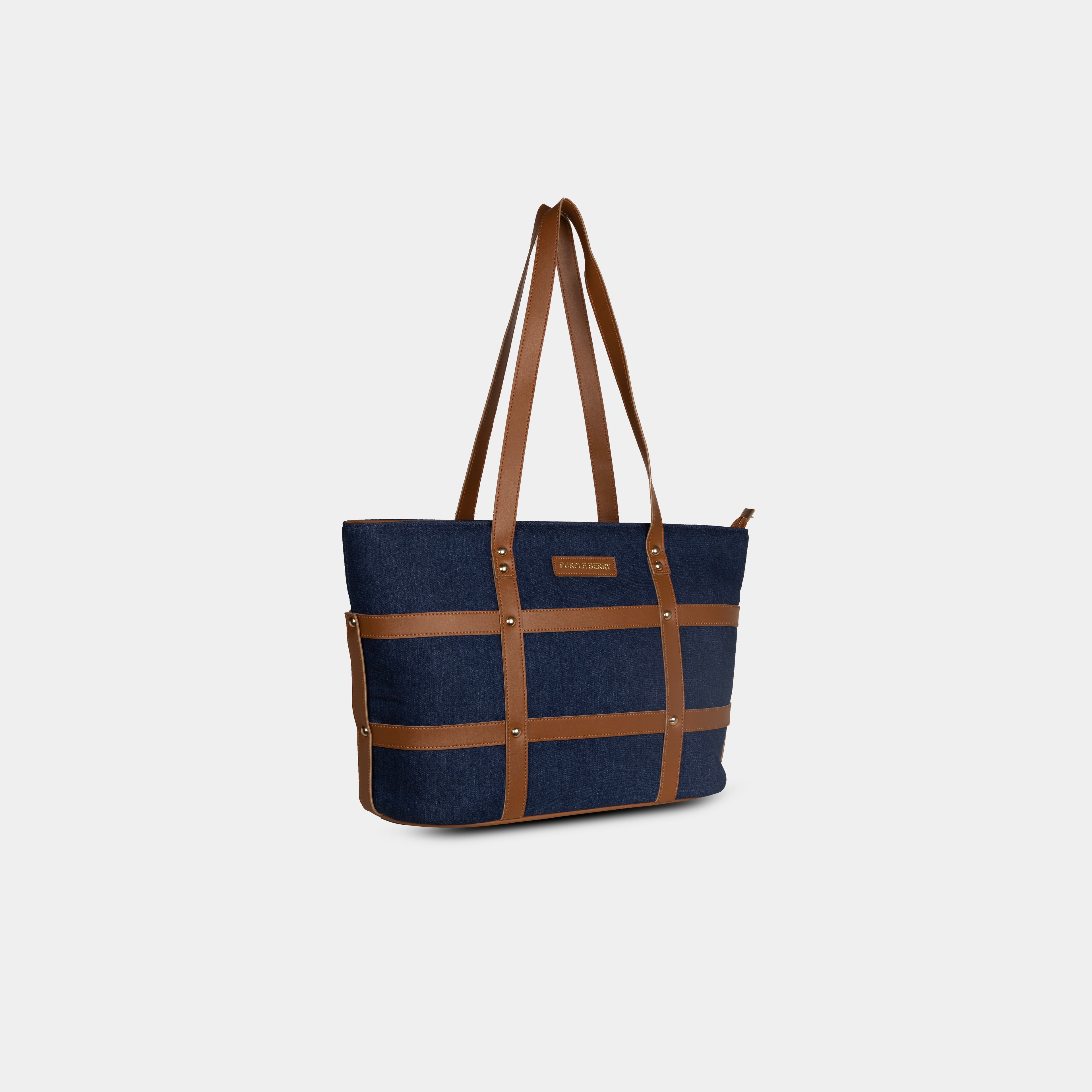 Dark blue Harper denim handbag with faux leather grid overlay and structured shape – angled view