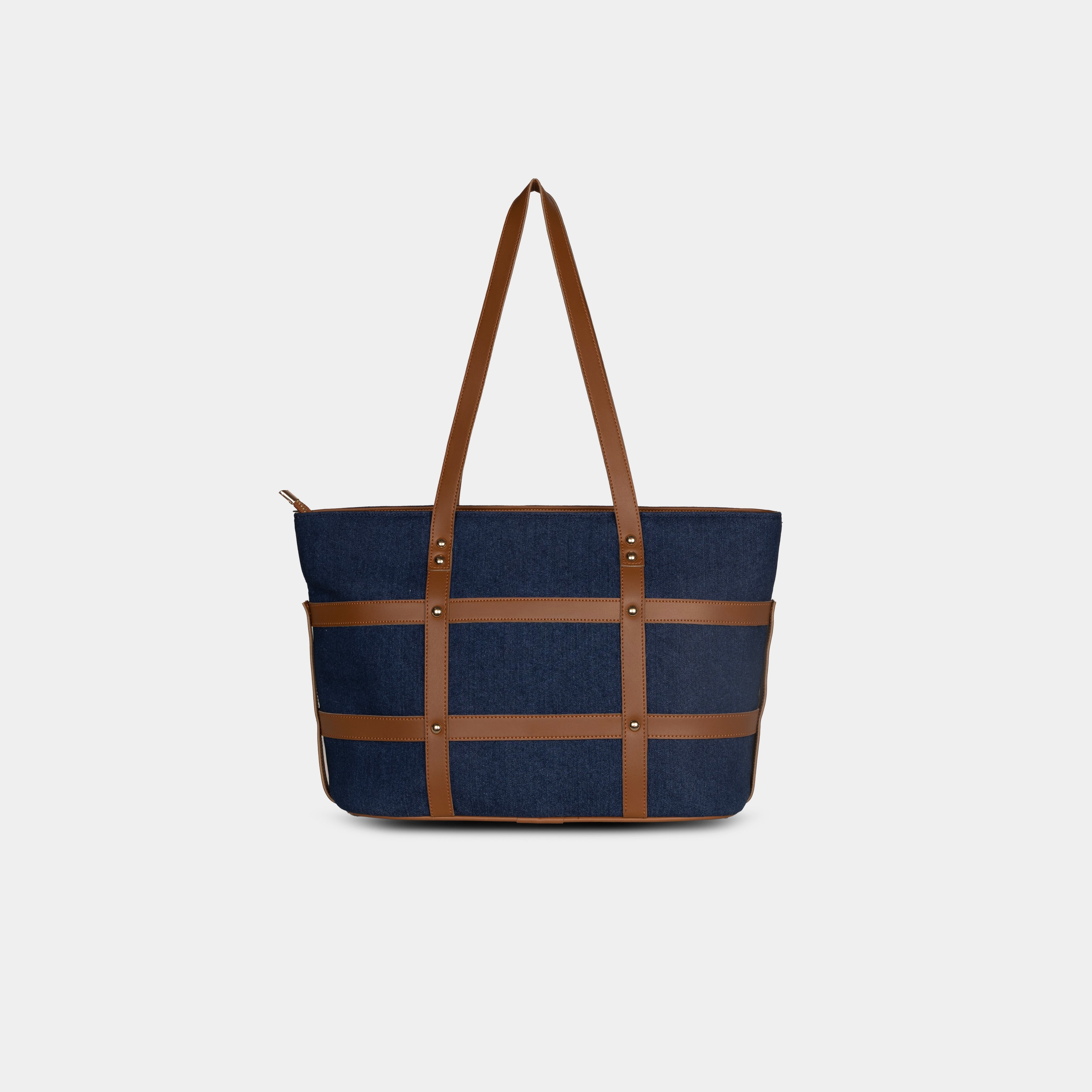 Back view of dark blue Harper denim handbag with smooth faux leather trim and structured silhouette