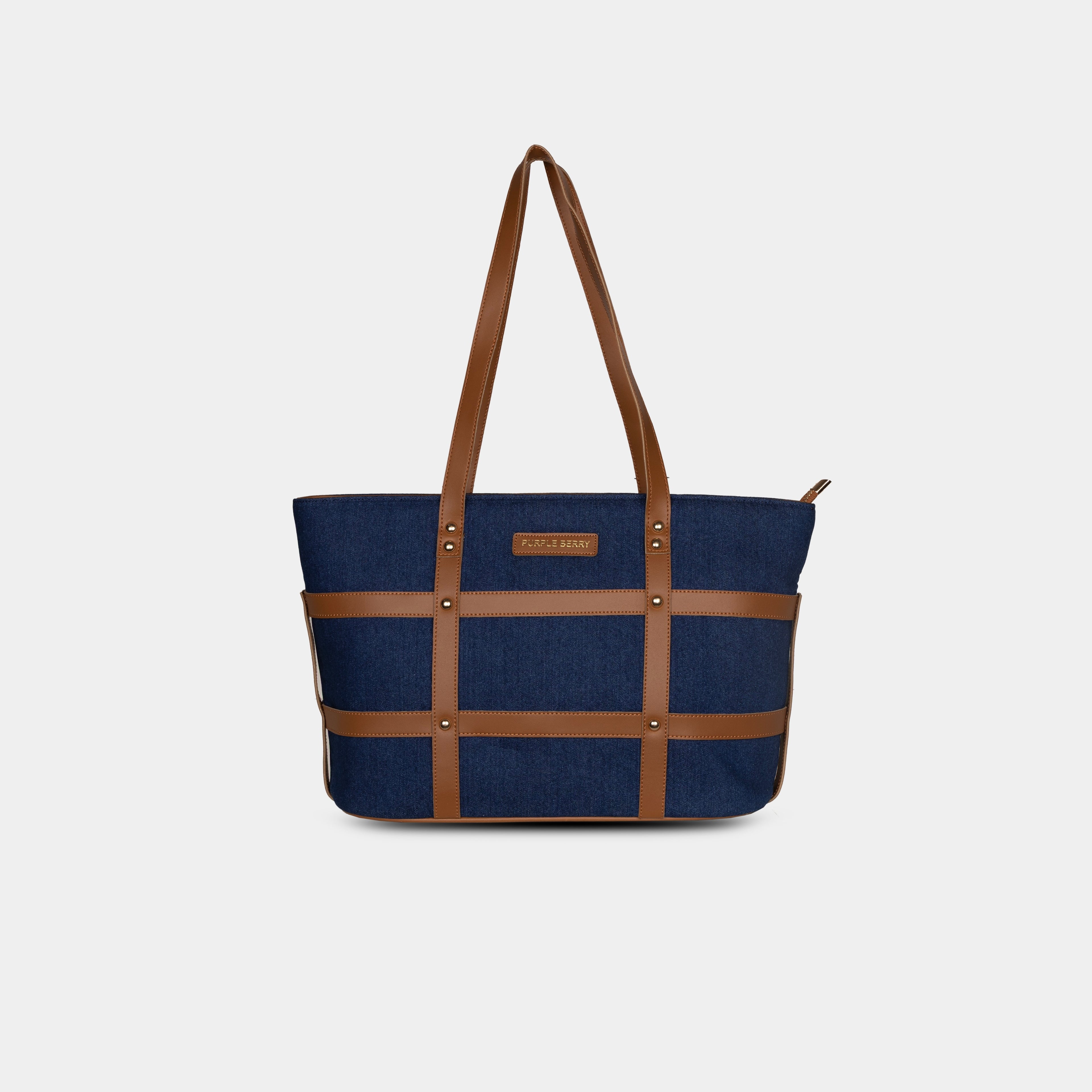 Purpleberry Harper grid-strap denim handbag in classic dark blue with faux leather cage overlay – front view