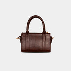 Back view of dark brown Lumière mini party bag showing structured silhouette