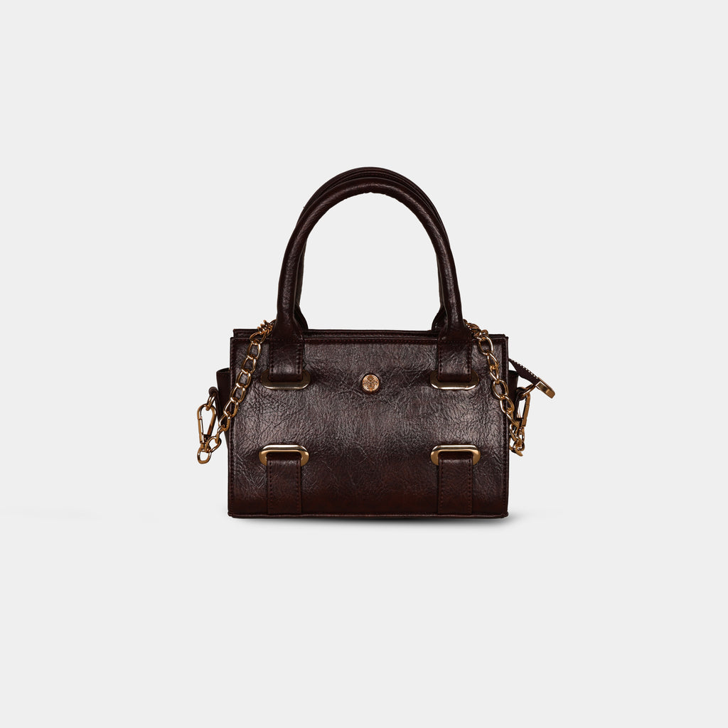 Close-up of detachable gold chain strap on dark brown Lumière mini party bag