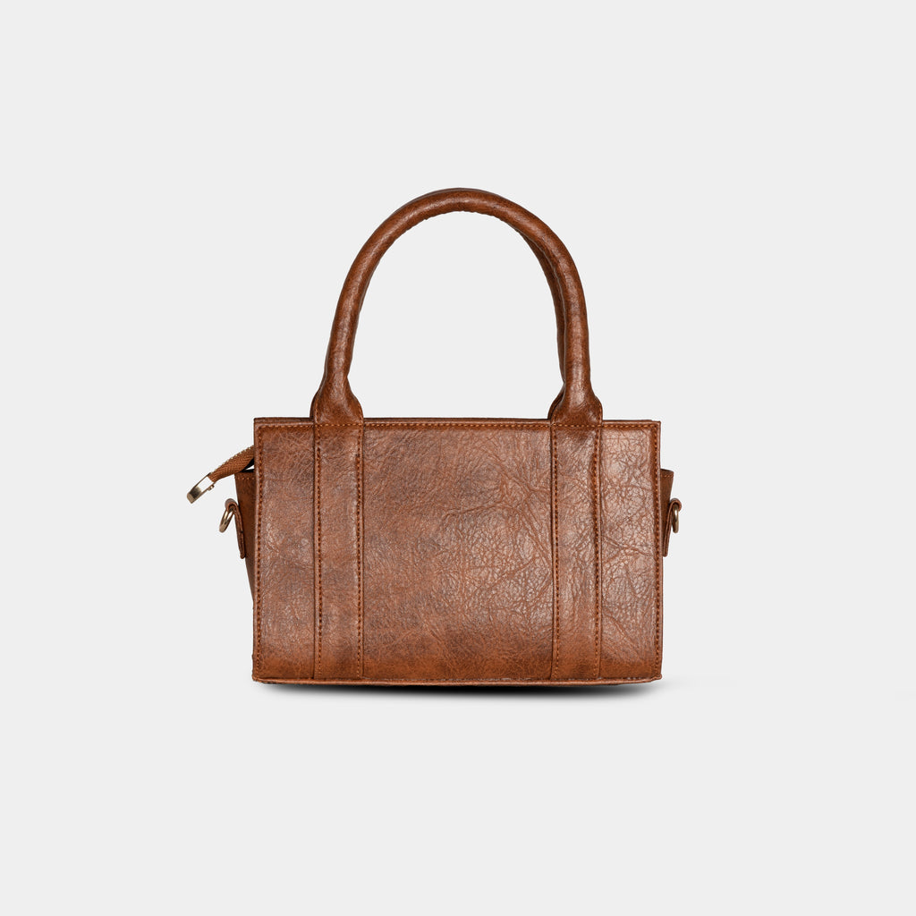 Back view of a light brown Lumière mini party bag showing a structured silhouette