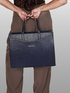 Model carrying blue Anie office tote for work
