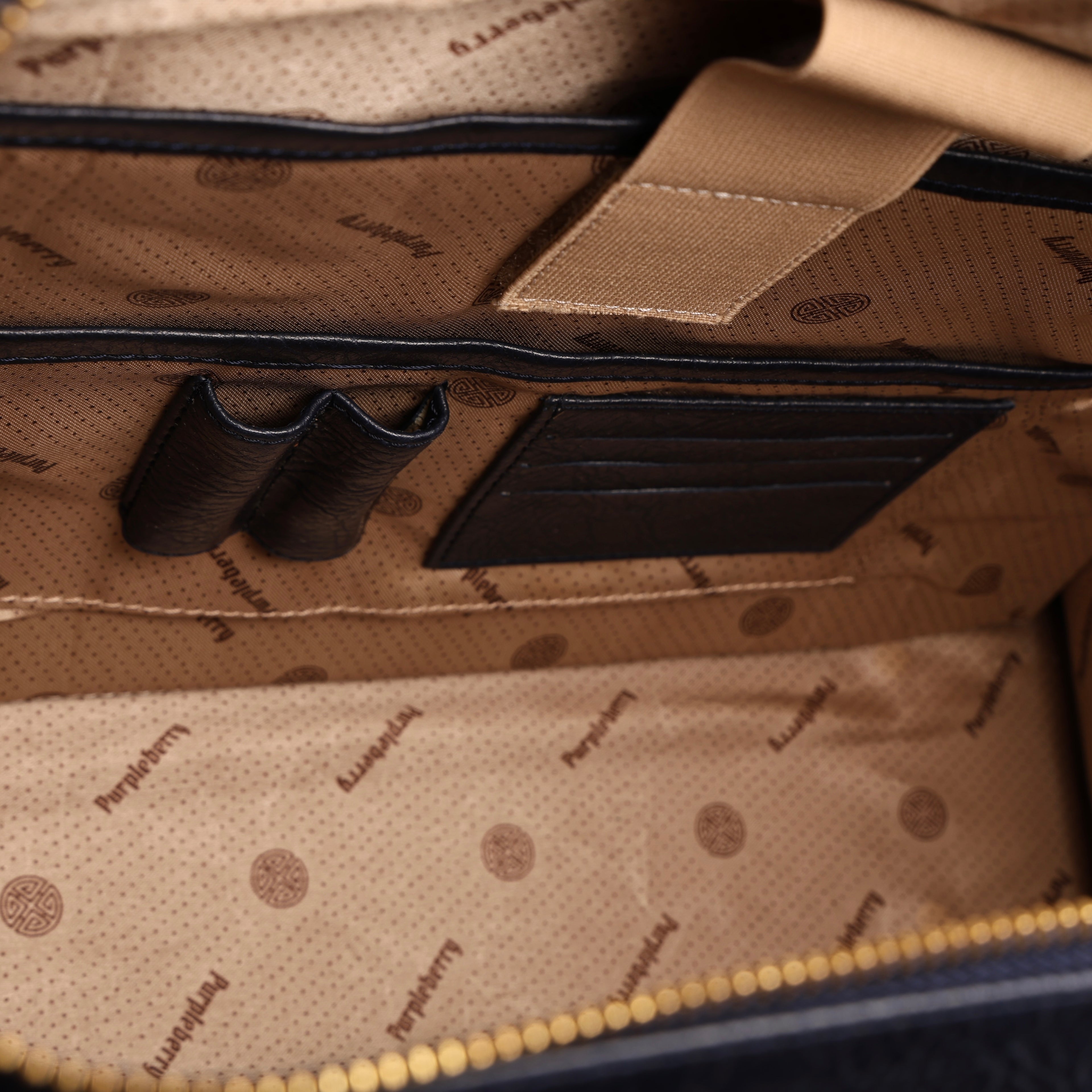 Built-in pen holders inside blue office tote bag