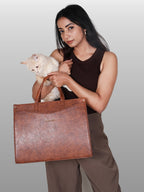 Model carrying Brown Anie office tote for work