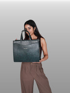 Model carrying green Anie office tote for work