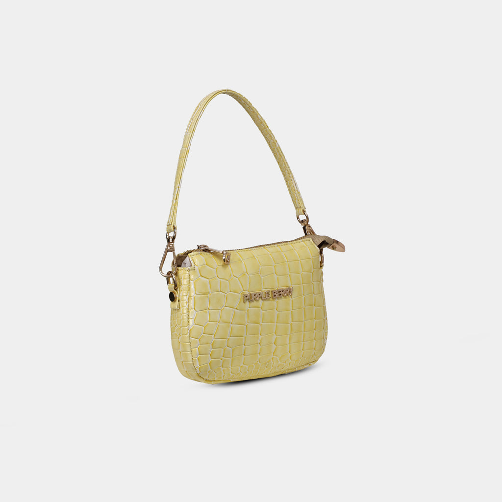 Side profile of Purpleberry Aria yellow croc embossed mini handbag