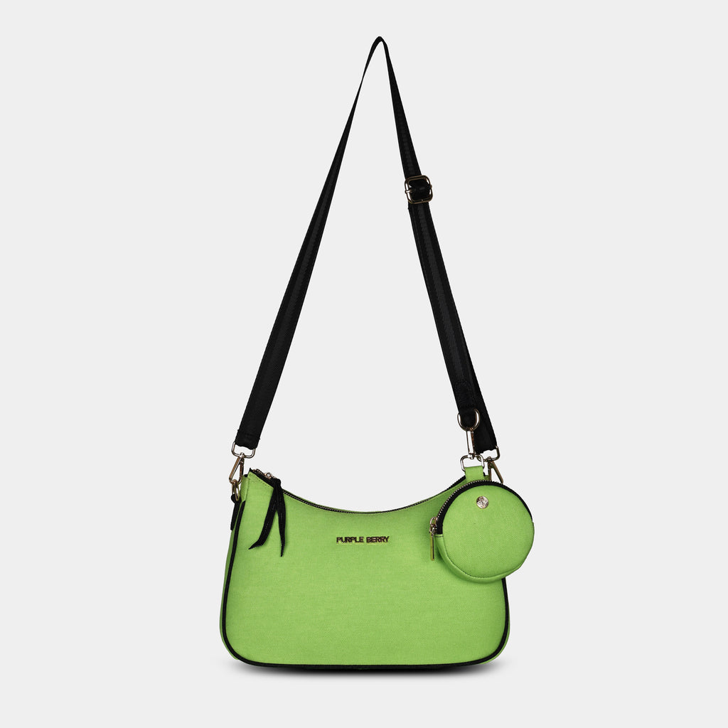 Front hanging view of green Bili denim sling bag showing curved design and gold hardware