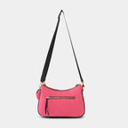 Back view of pink Bili denim sling bag showing secure zipper pocket and structured denim body