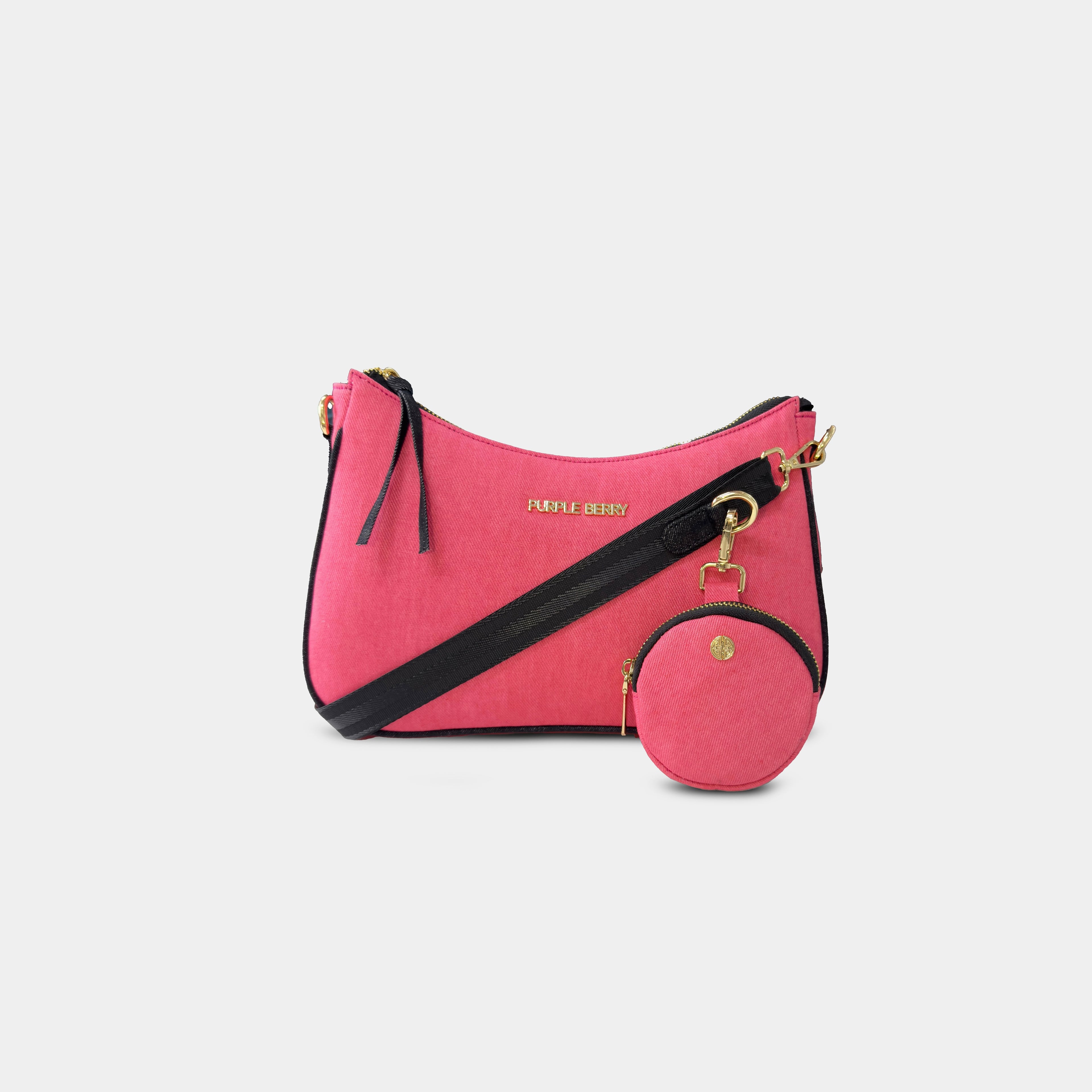 Pink Bili denim sling bag with detachable matching coin pouch and adjustable black crossbody strap