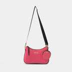 Front hanging view of pink Bili denim crossbody sling bag with curved silhouette and gold hardware