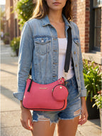 Woman carrying pink Bili denim sling bag crossbody style demonstrating everyday street fashion look
