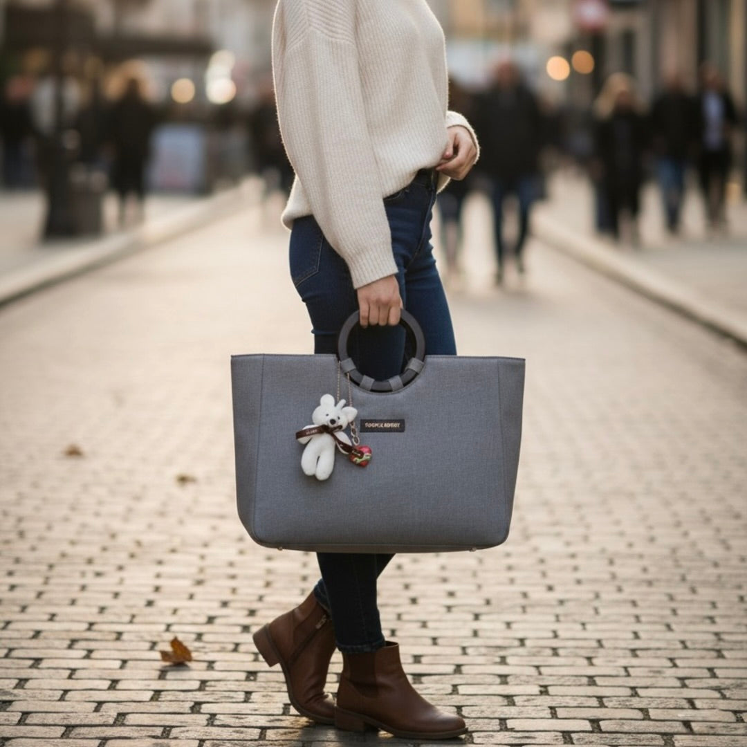 Grey denim office tote women posing while holding grey bag