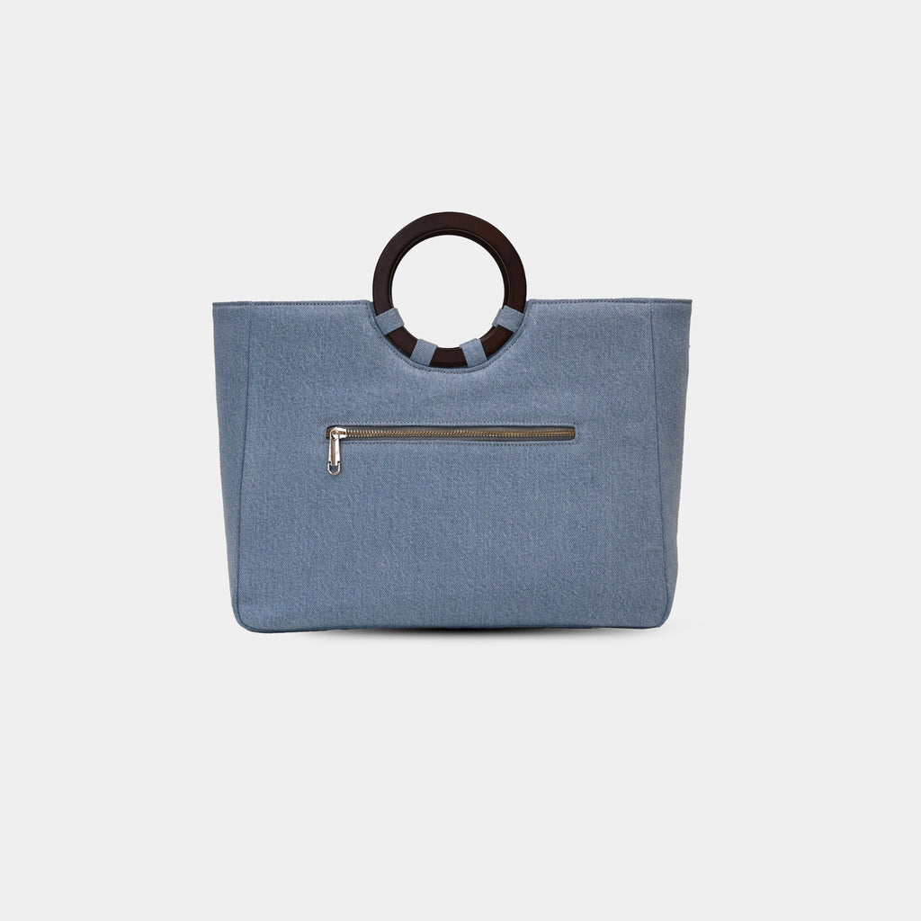 Back view of light blue denim office tote with zipper pocket detail