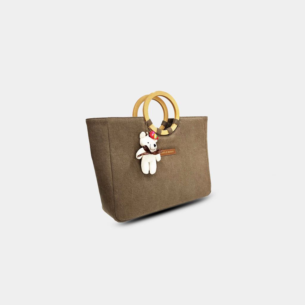 Side angle of mocha mousse denim tote showing structured profile