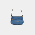 Close up of leopard print strap and gold hardware on Purpleberry Fehu blue denim sling
