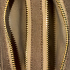 Front zip pocket detail of Purpleberry Fehu brown denim sling bag