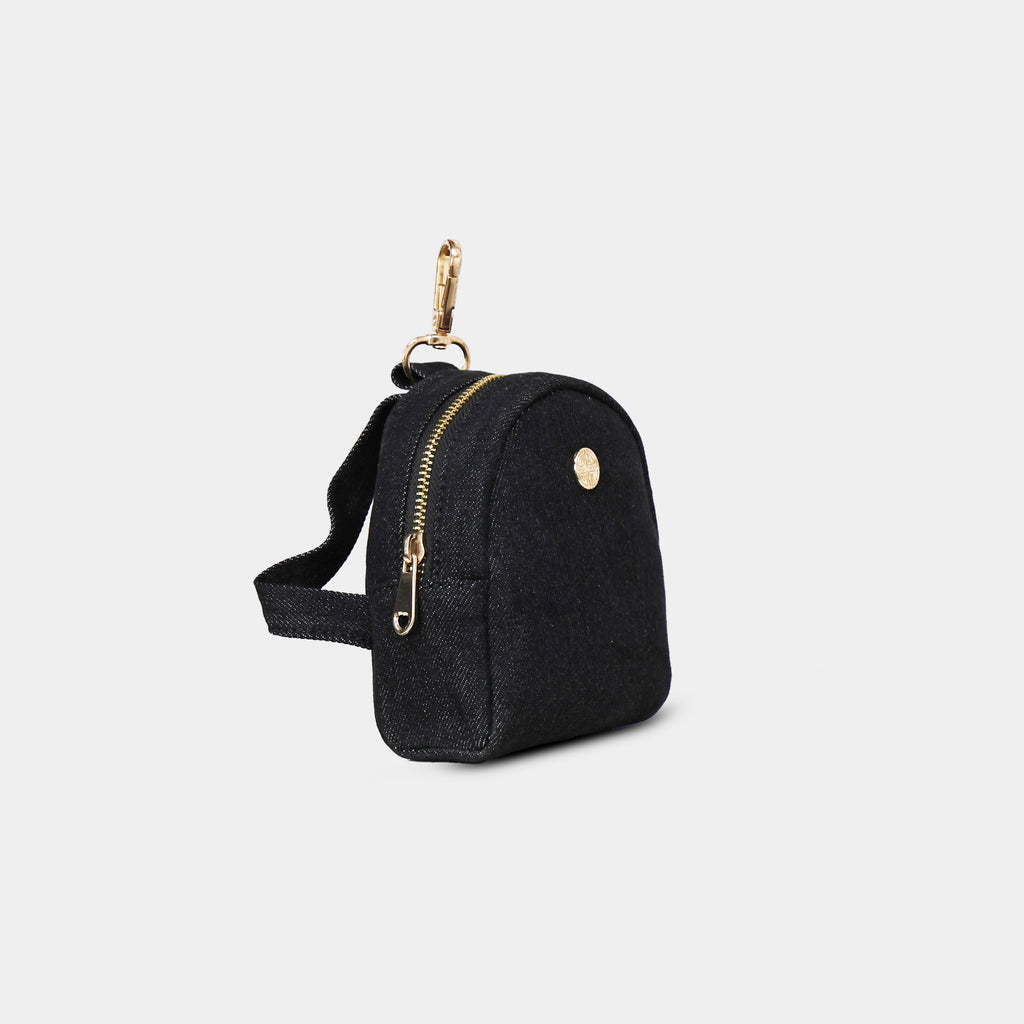 Side profile of Purpleberry Indigo black denim micro backpack
