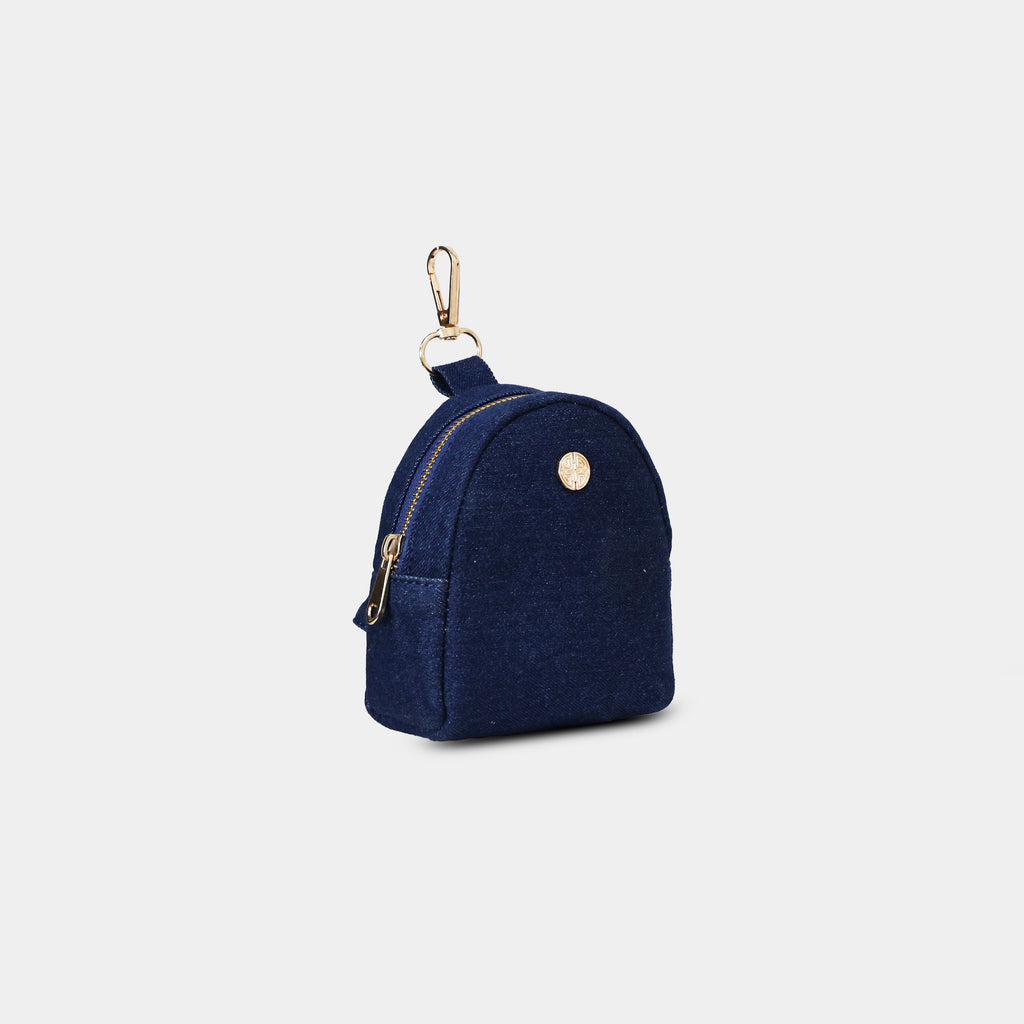 Side profile of Purpleberry Indigo blue denim micro backpack