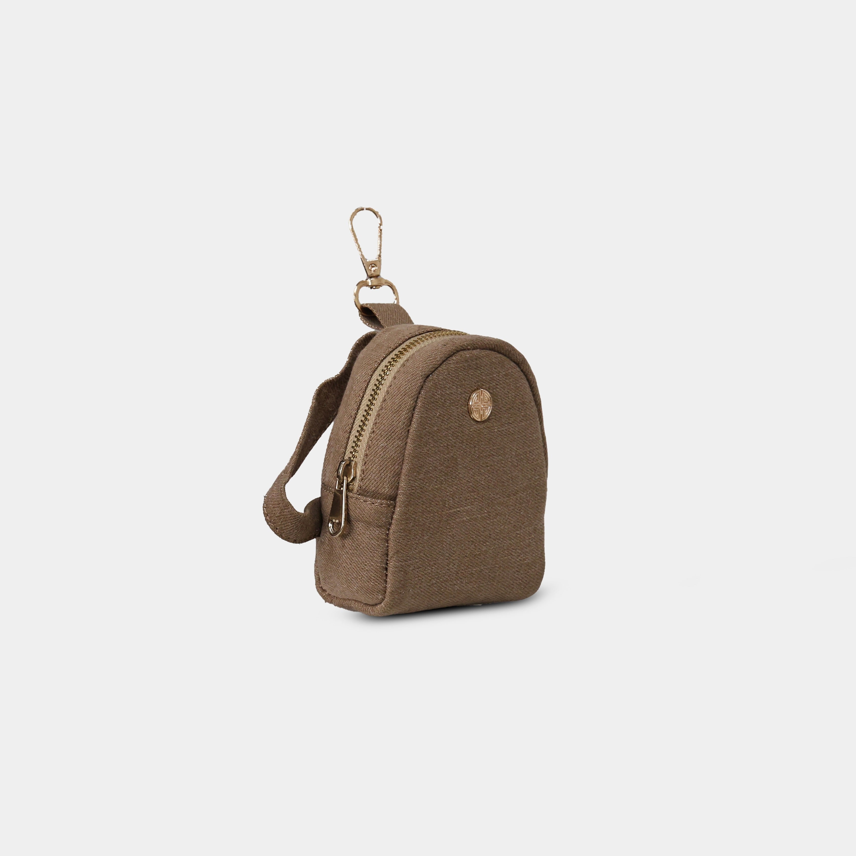 Side profile of Purpleberry Indigo brown denim mini backpack