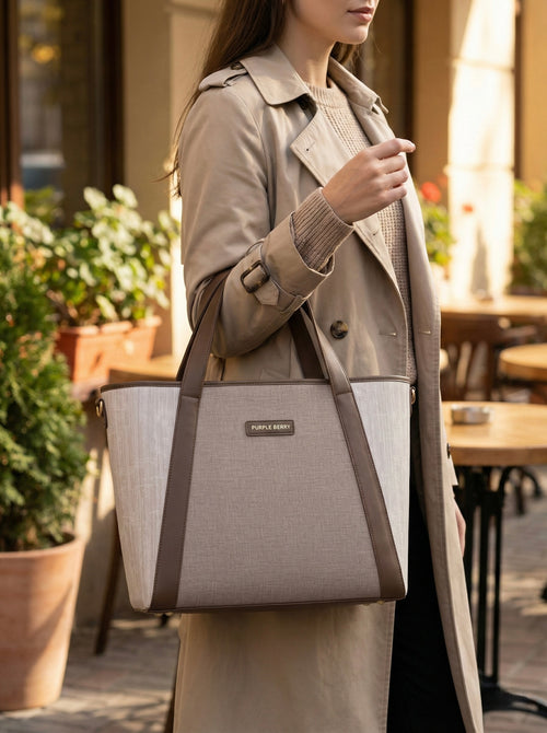 Model carrying beige Lexie Office Tote bag with brown handles