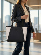 Model carrying black Lexie Office Tote bag