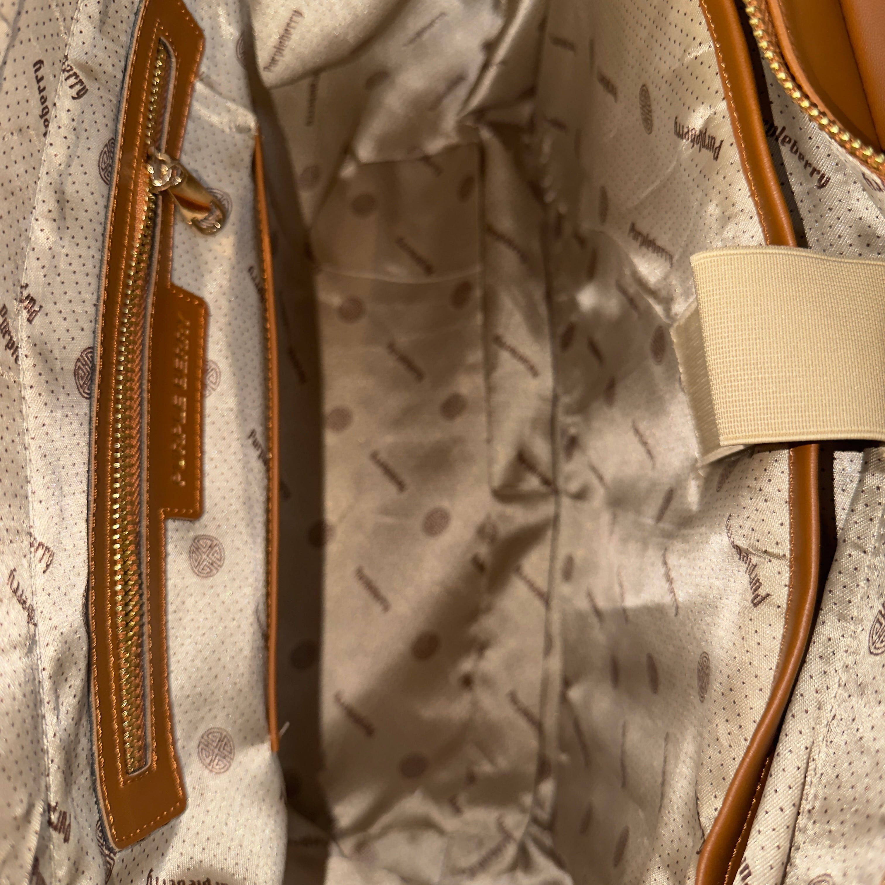 Interior view of brown Lexie Office Tote showing zipper pocket and lining