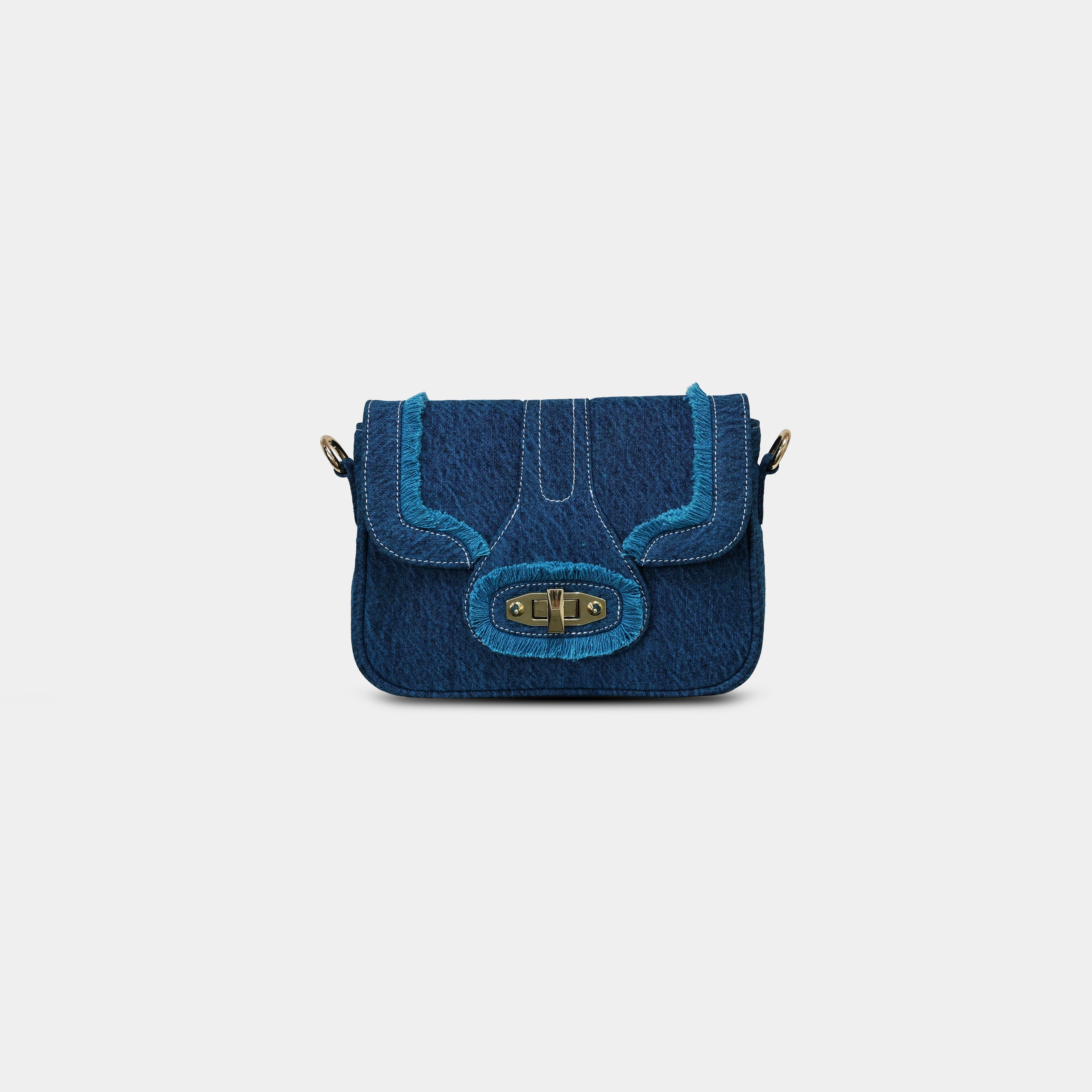 Purpleberry Luna denim sling bag in blue wash with fringe flap and gold rotating lock