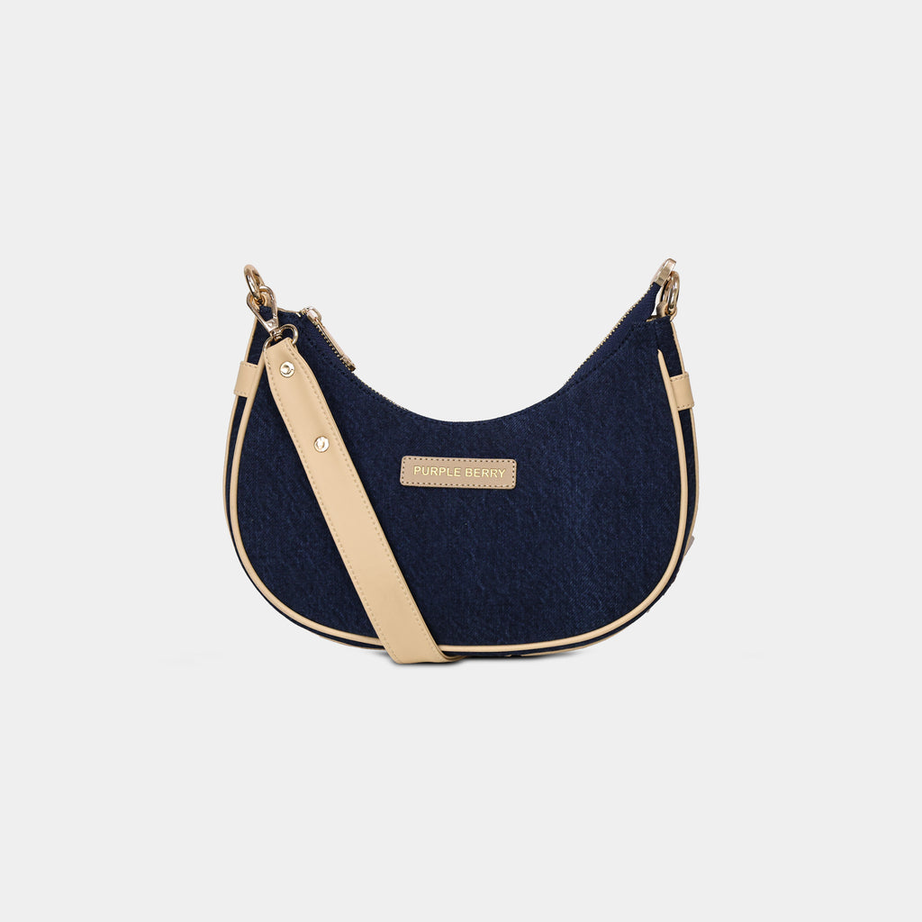 Purpleberry Moda blue denim crescent sling bag with beige contrast trim front view