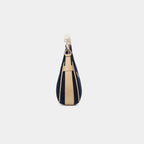 Side profile of Purpleberry Moda blue crescent denim shoulder bag