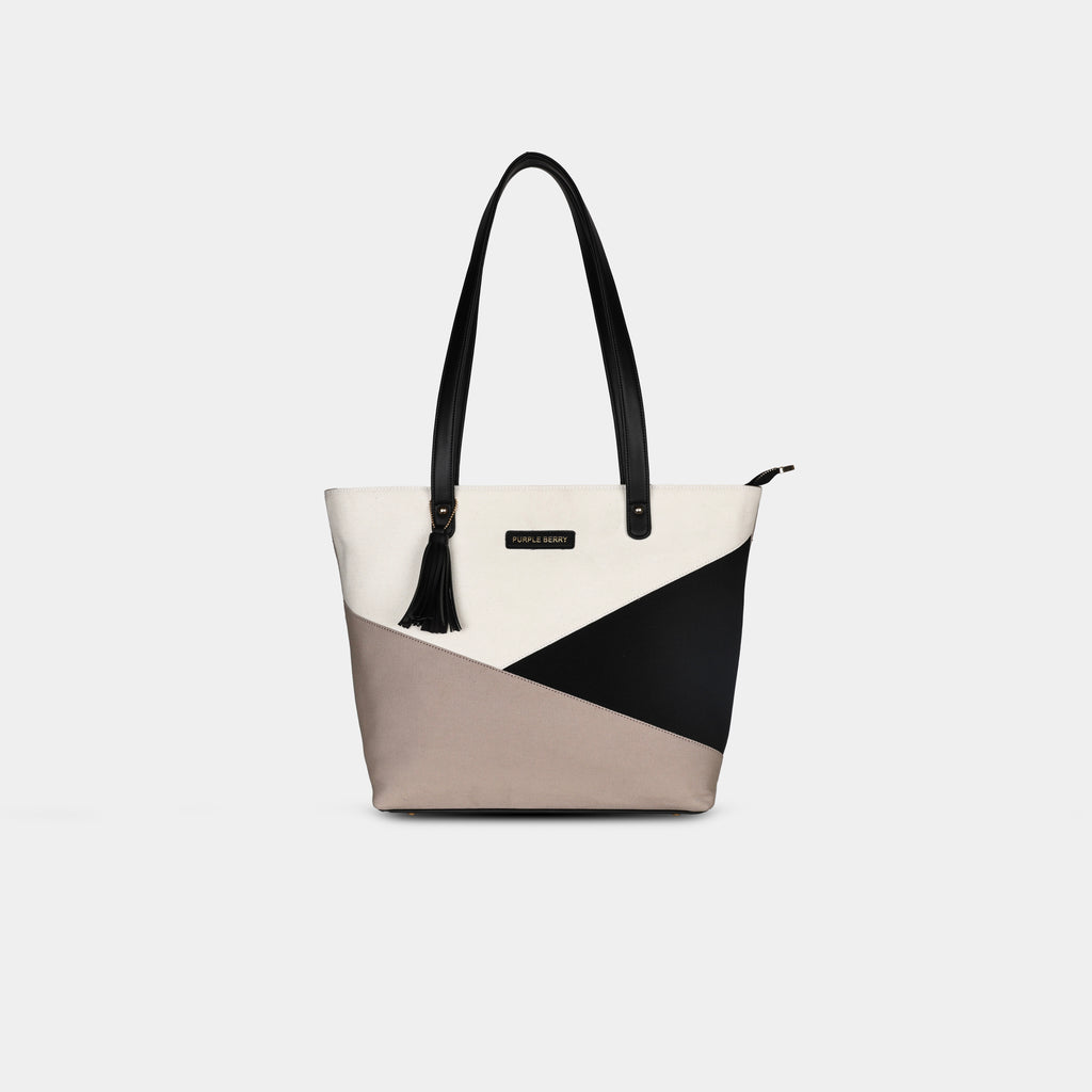 Prism canvas multicolor geometric handbag front view showing contrasting canvas panels and structured design