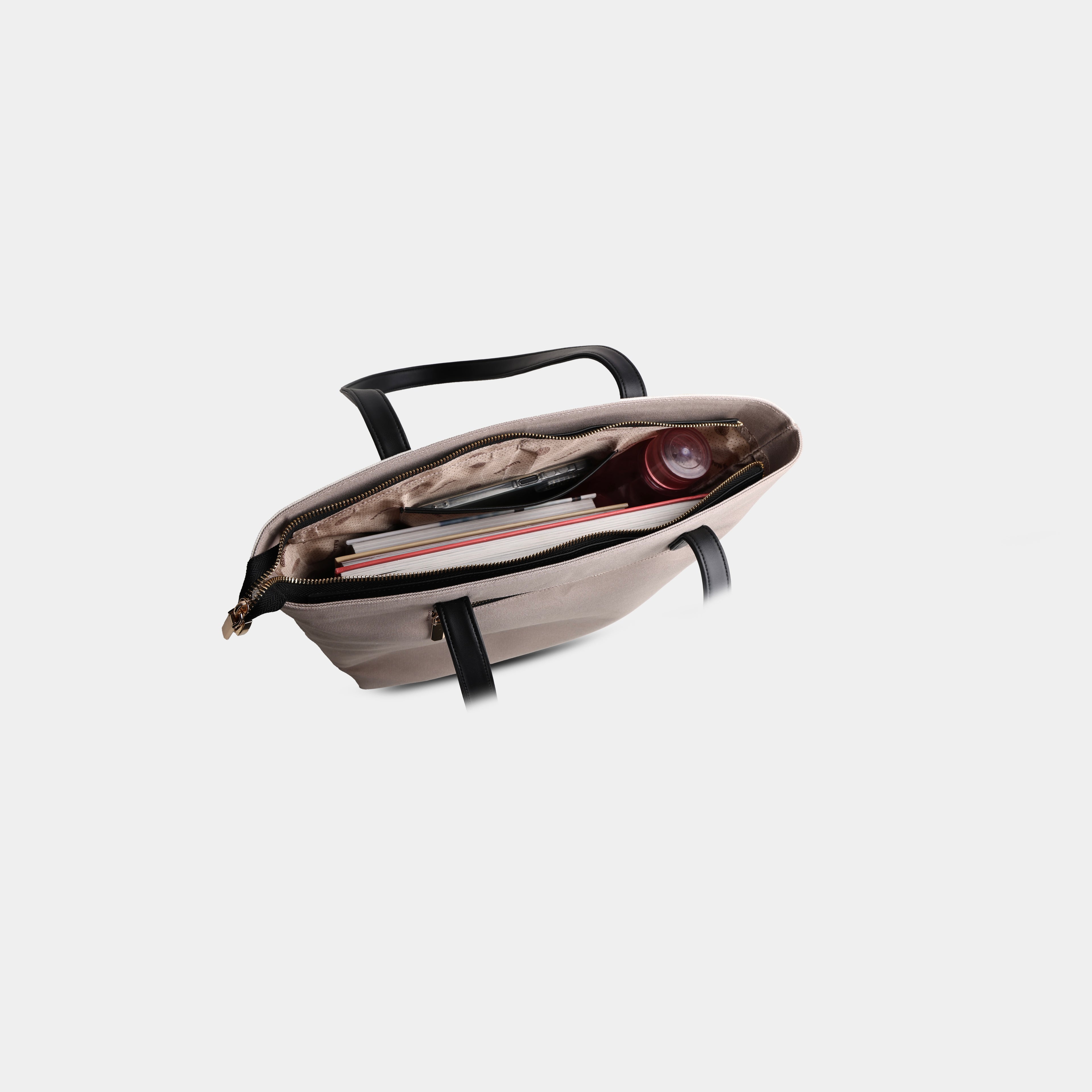 Top Angled perspective of multicolor Prism canvas tote, highlighting  internal long view of accessories 