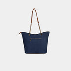 Rear zip pocket detail on navy star print handbag