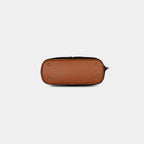Bottom view of dark brown star print handbag with a vegan leather base strap