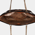 Close-up of dual-tone gold chain and vegan leather shoulder strap